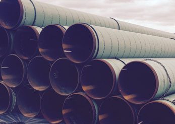 Stacked large industrial steel pipes outdoor
